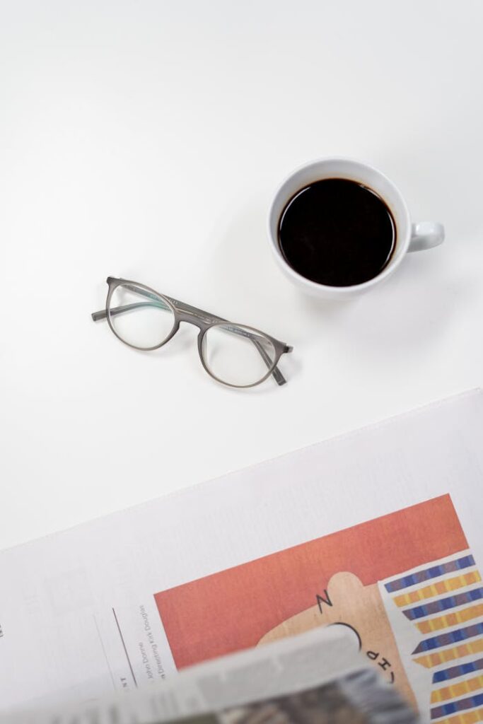 Black Framed Eyeglasses on White Table